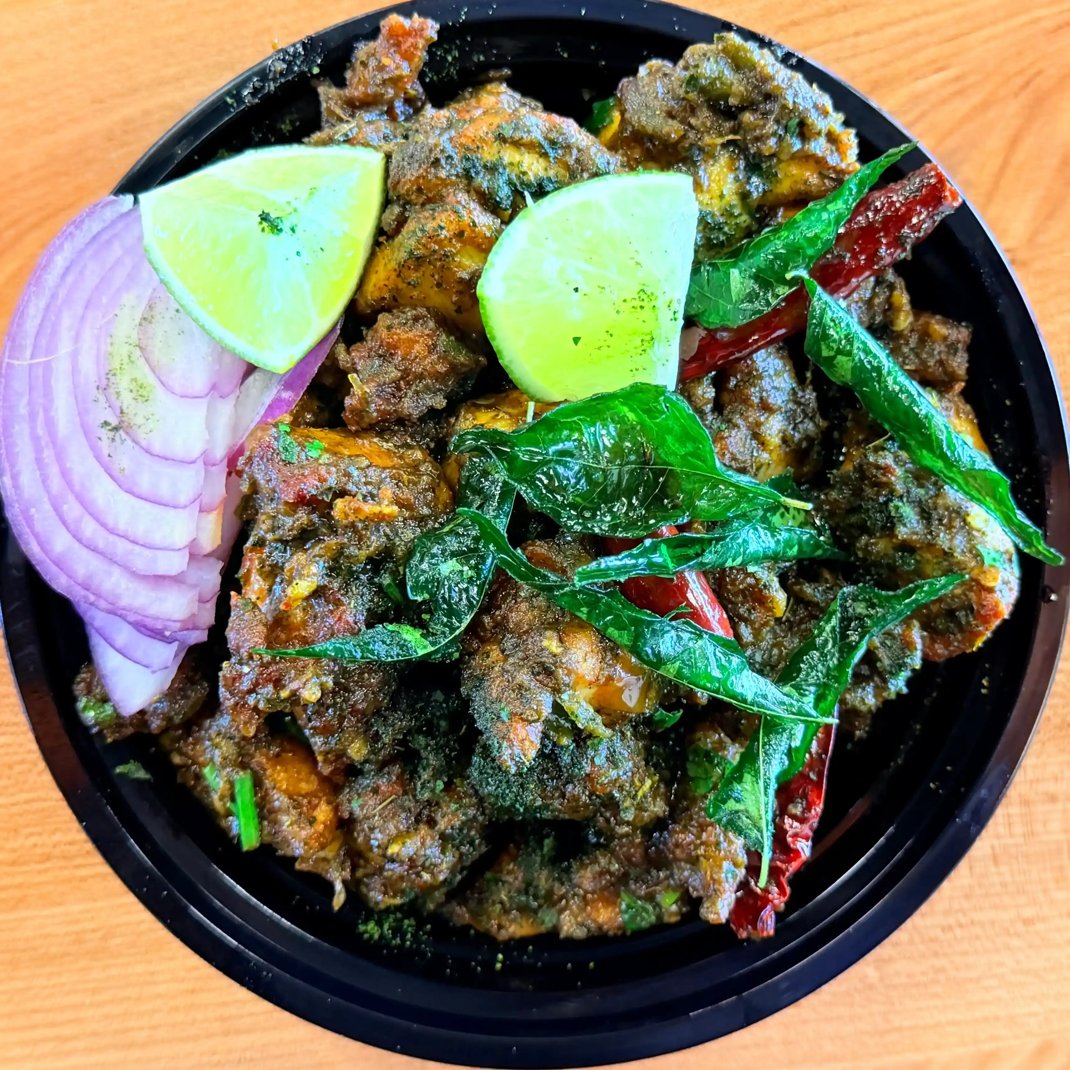 Karivepaku Chicken — Savor the distinctive fragrance of fresh curry leaves, beautifully at Hashtag India, Overland Park